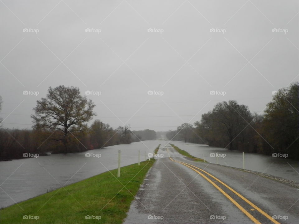 River flooded over roadway