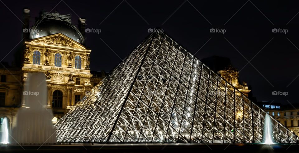 The Louvre museum in Paris, at night