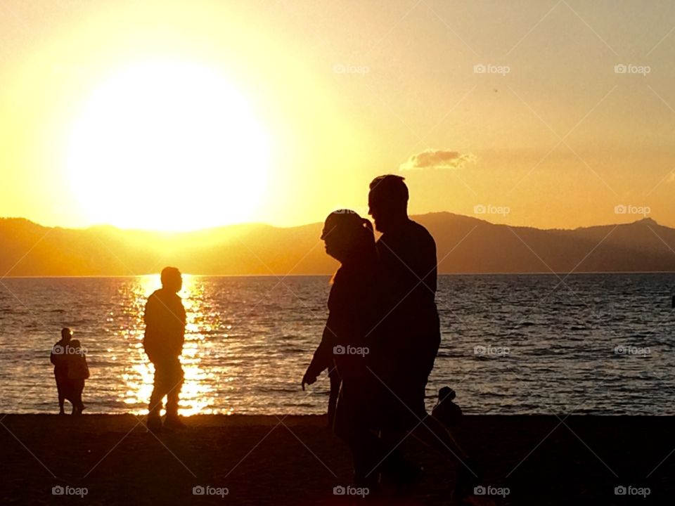 Sunset, lake and people