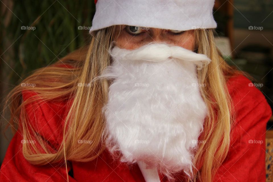 Close-up of a woman dressed up as Santa Claus