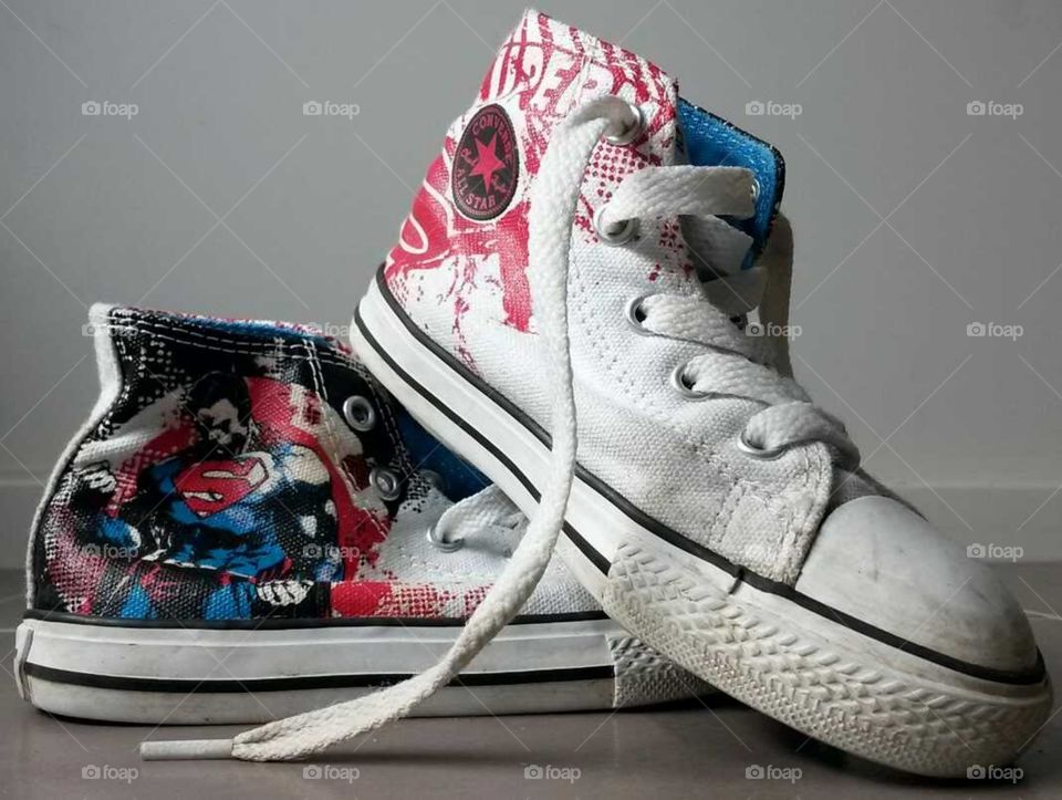 closeup of a young boys superhero high top sneaker shoes