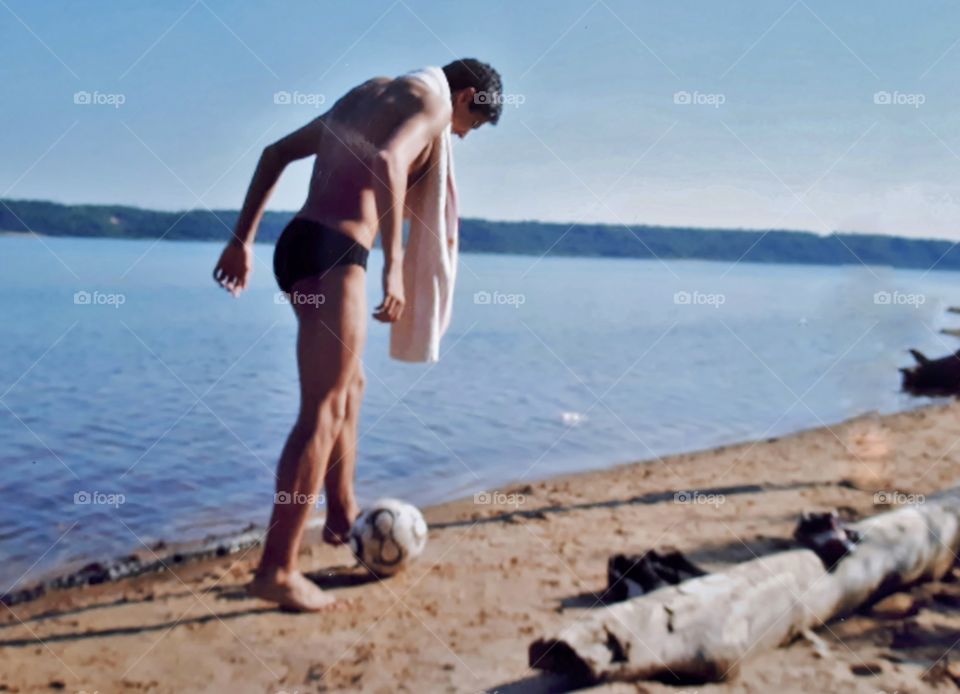 A young man is resting on beach