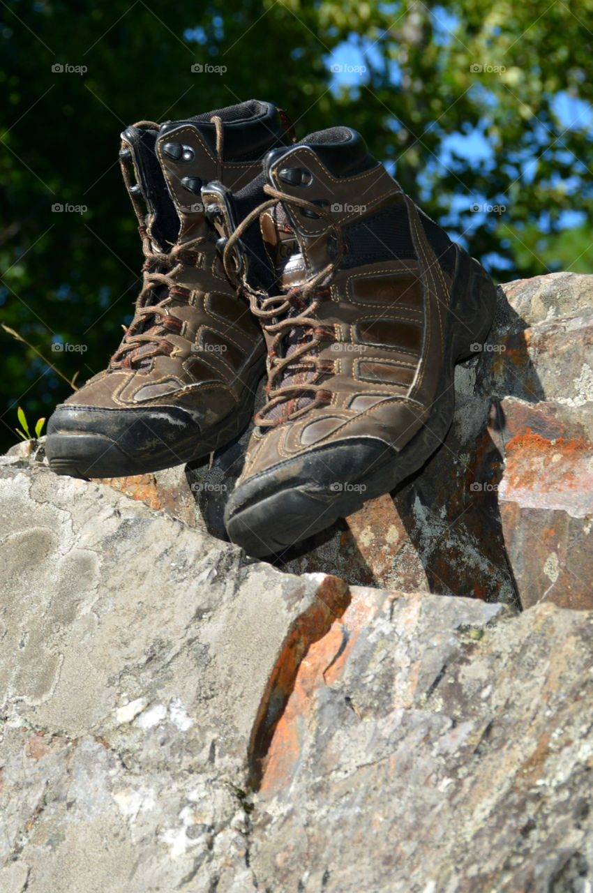 The boots were old. The leather had since cracked and aged. The toes were scuffed and they were falling apart at the seams. The boots had long lived their life of travel,work,joy, and love. After their final journey, it was time to throw them away. It was hard to say GOODBYE!