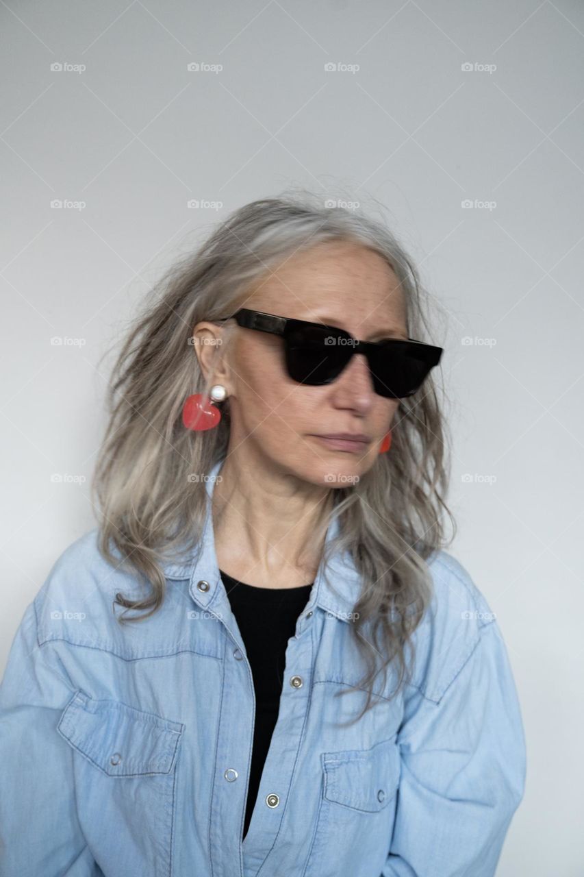 Silver hair woman wearing sunglasses 