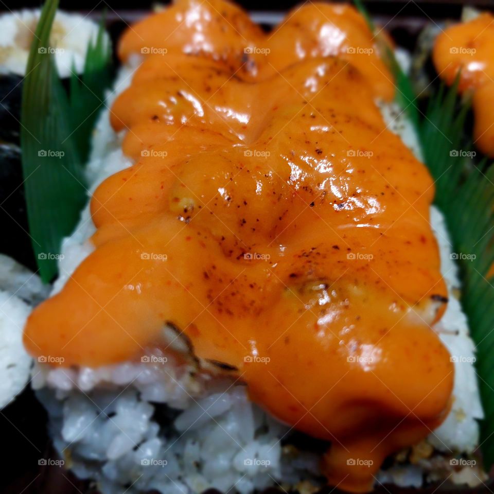 assorted sushi served in a container