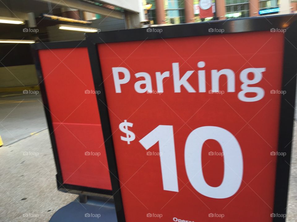 Red Ten dollar $10 parking sign