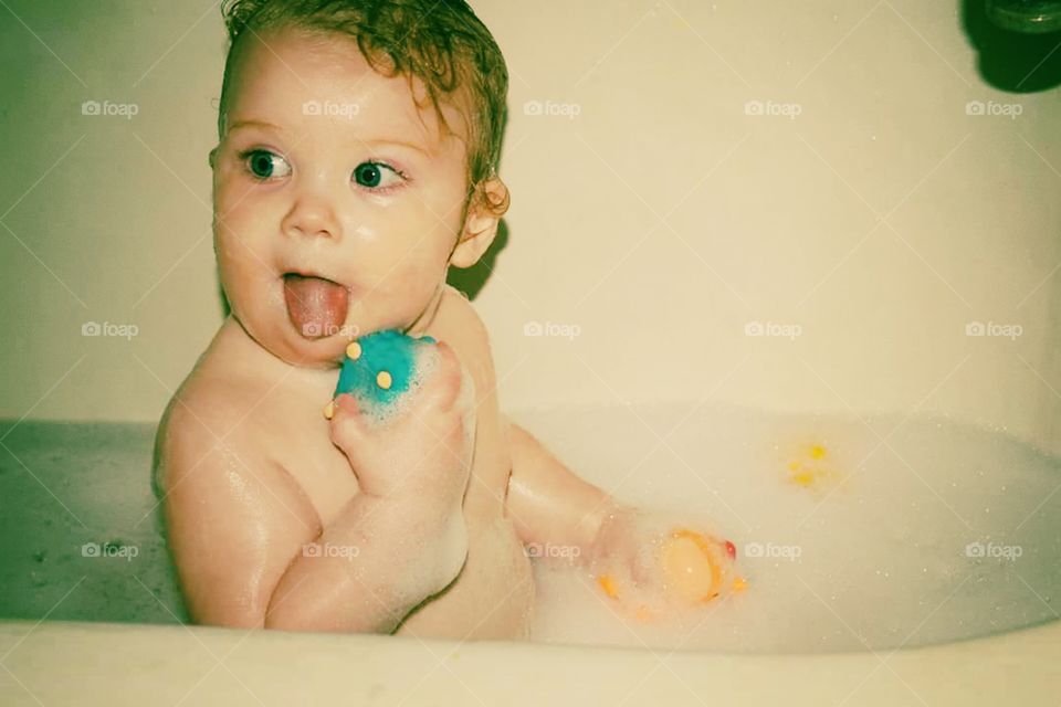 Close-up of baby in bath tub
