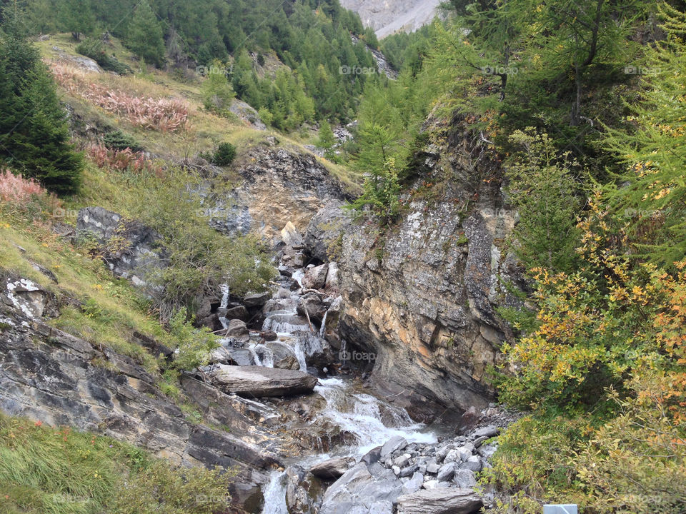 river in the mountains between rocks switzerland by swisstraveler