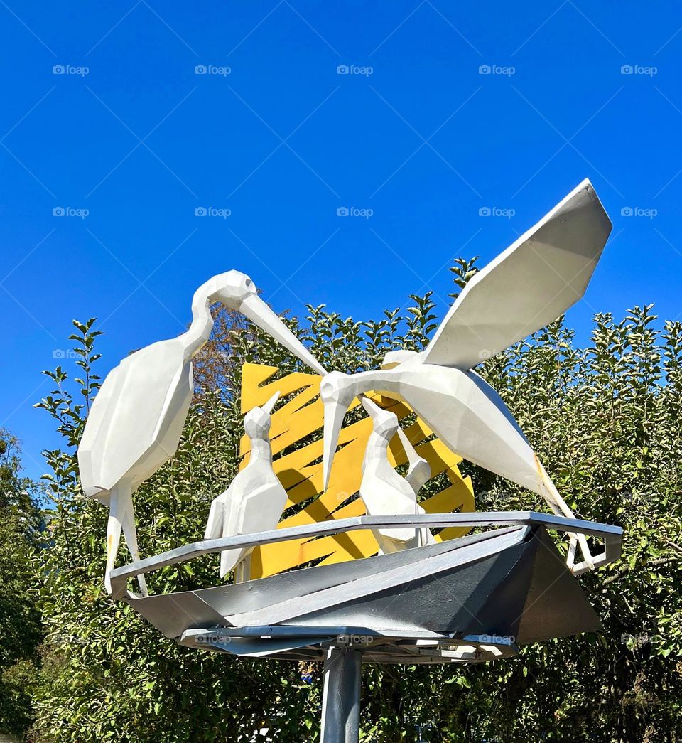 Sculpture of storks in the park