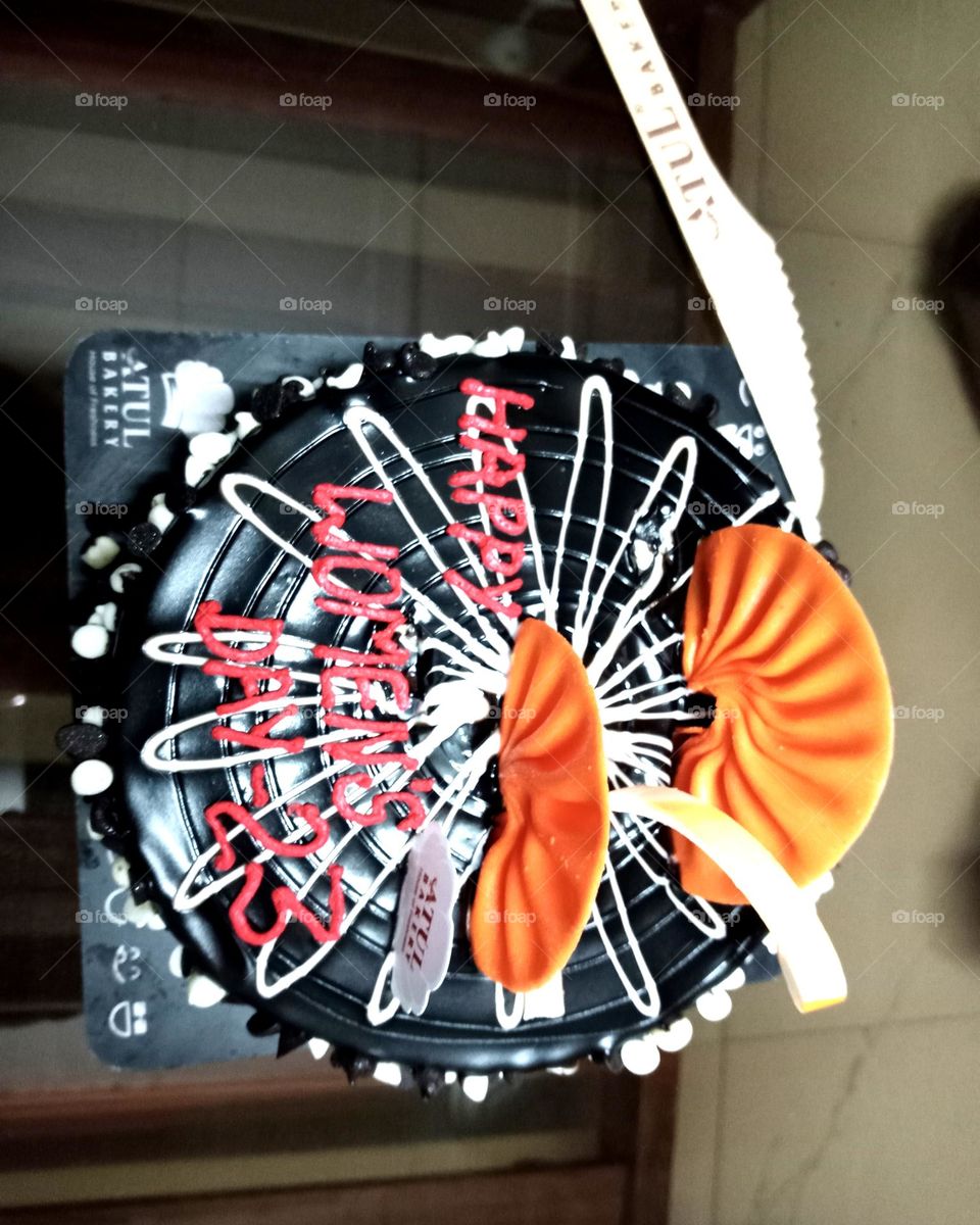 So testy and yummy chocolate cake with orange toppings looks so nice and so beautiful all events cut the cake like marriage ceremony, angejment event, baby sawer,