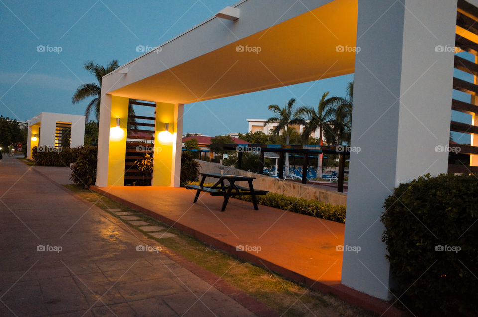 picnic bench beside a pool