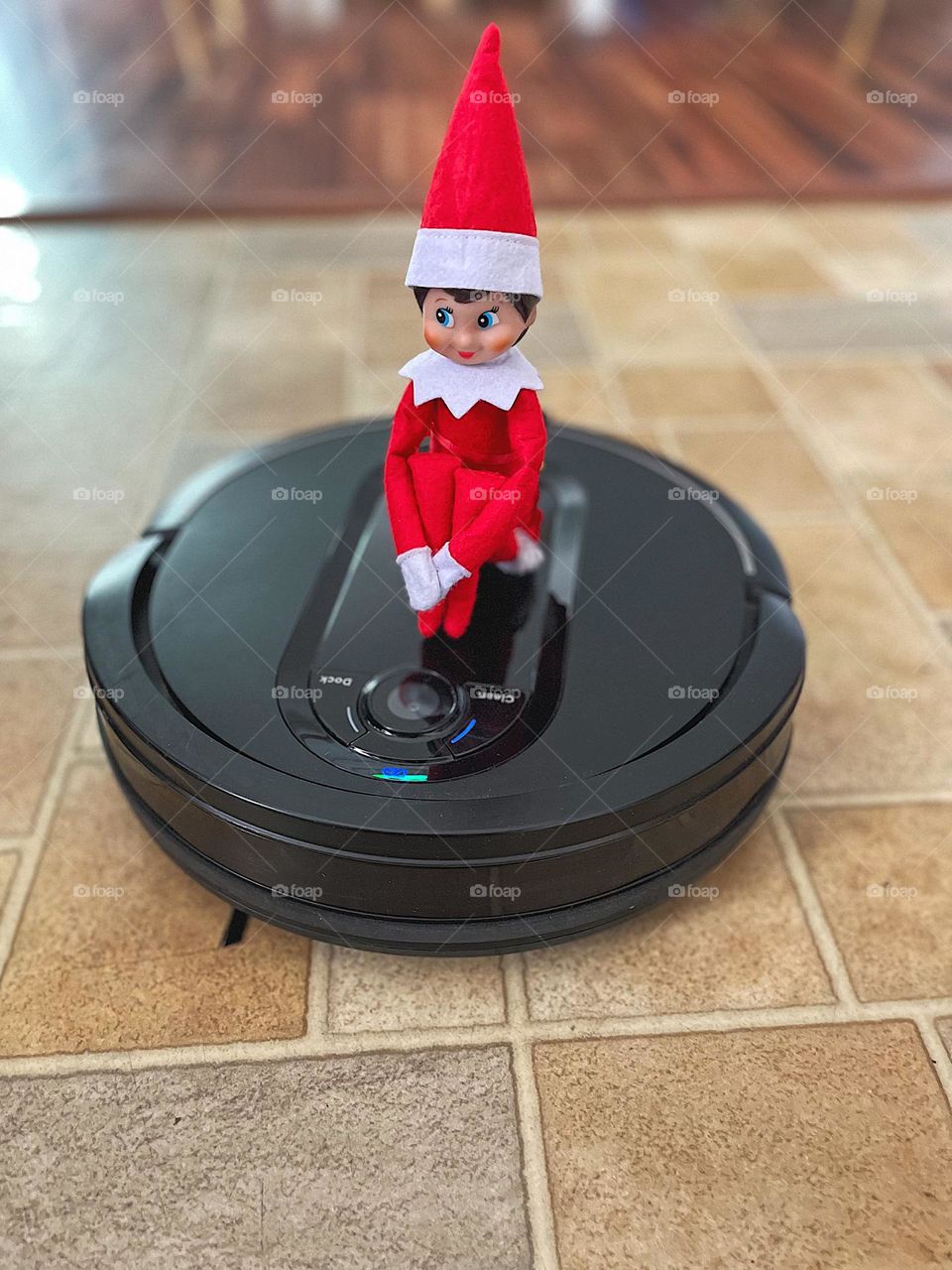 Elf on the shelf rides on robot vacuum, elf on the shelf antics, Christmas time traditions, elf on the shelf being silly, elf on the shelf helps clean up