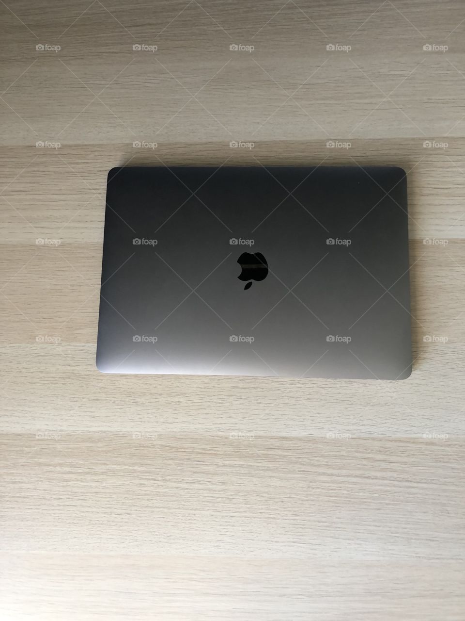 MacBook Pro on wooden table