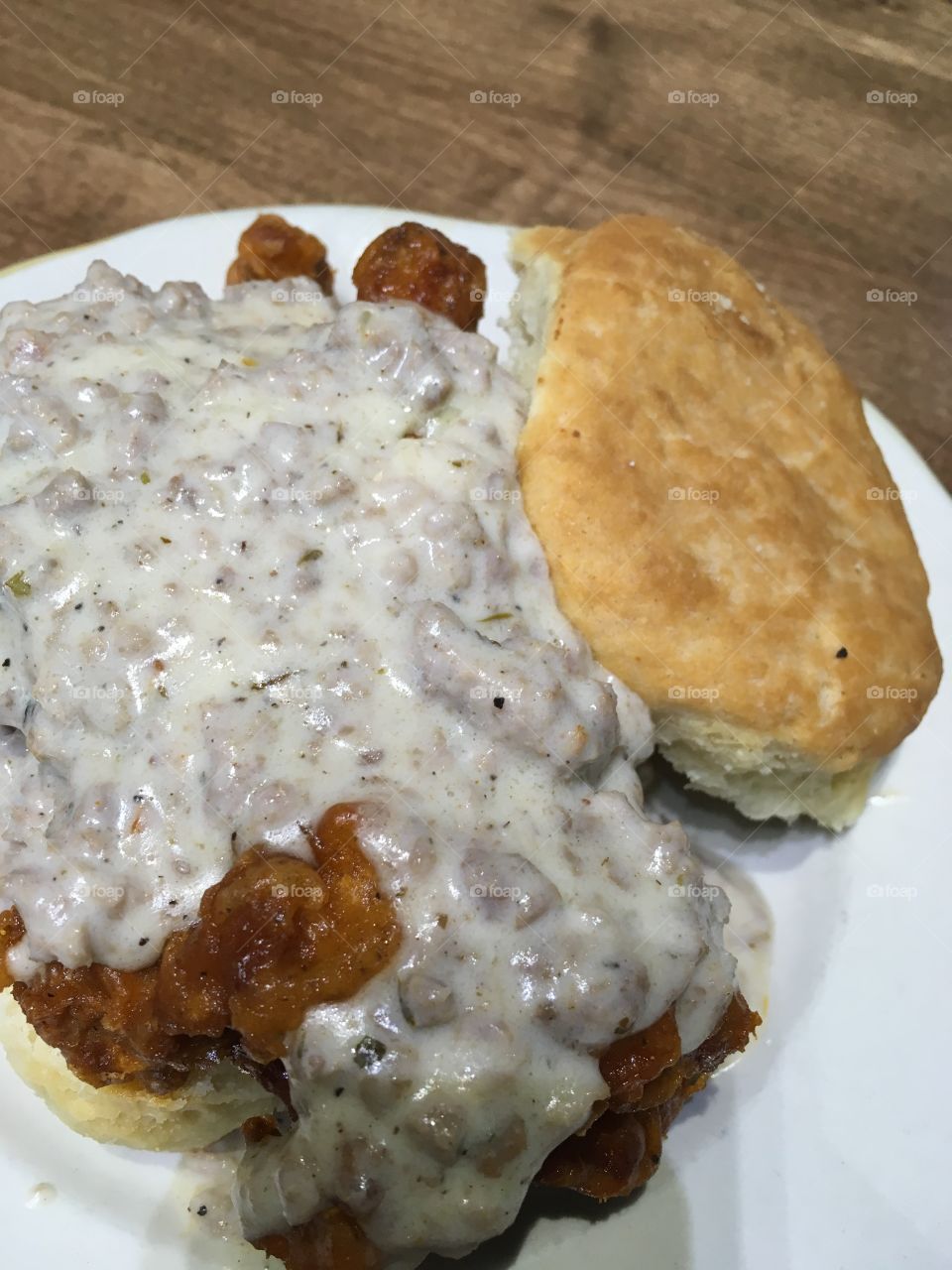 chicken and gravy on a biscuit