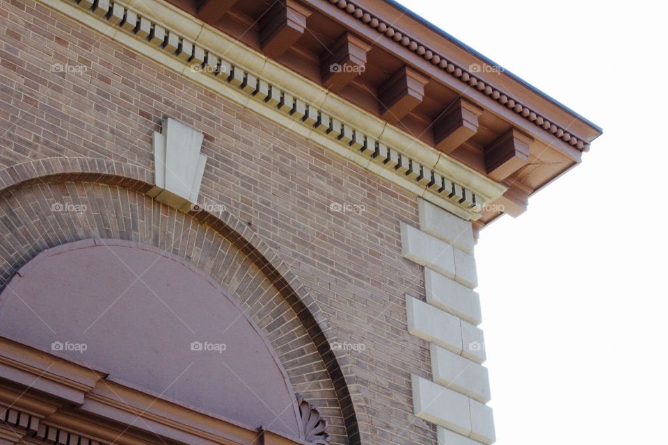 Architectural detail on the overhang and side of an historical building