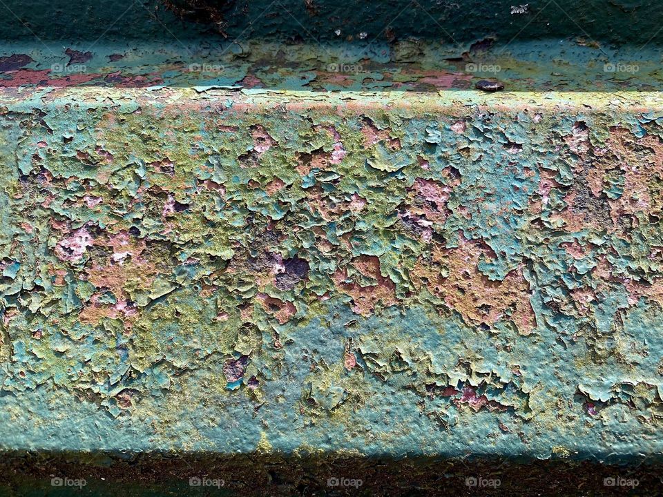 Rust and peeling paint on an old bridge
