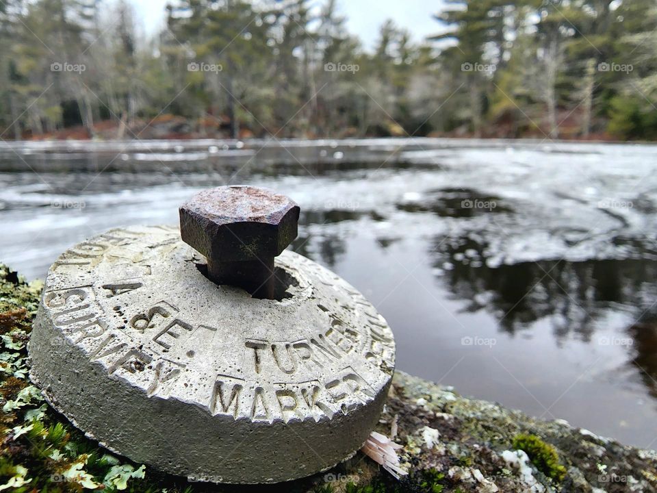 Metal land survey marker.