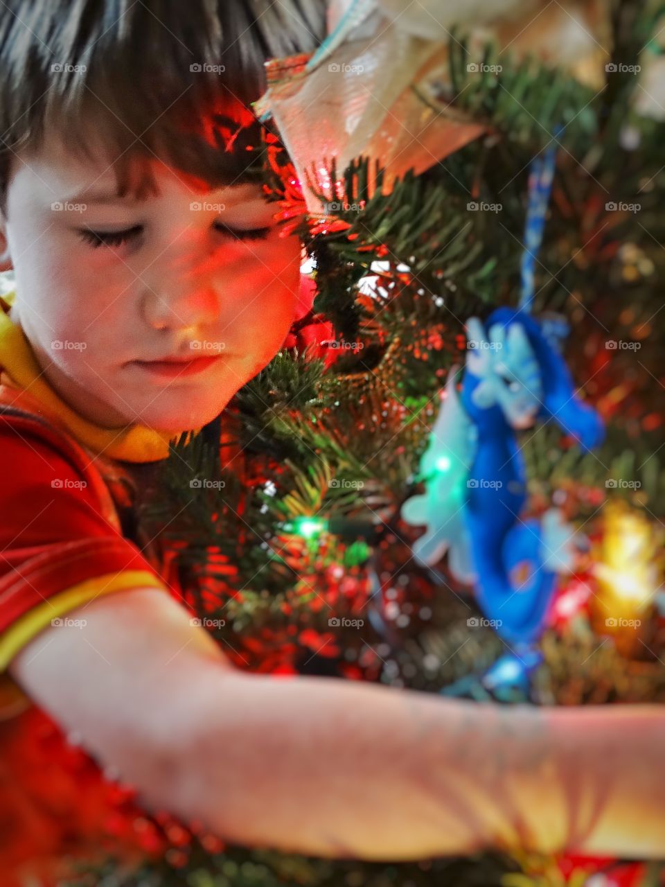 Boy Hugging His Christmas Tree
