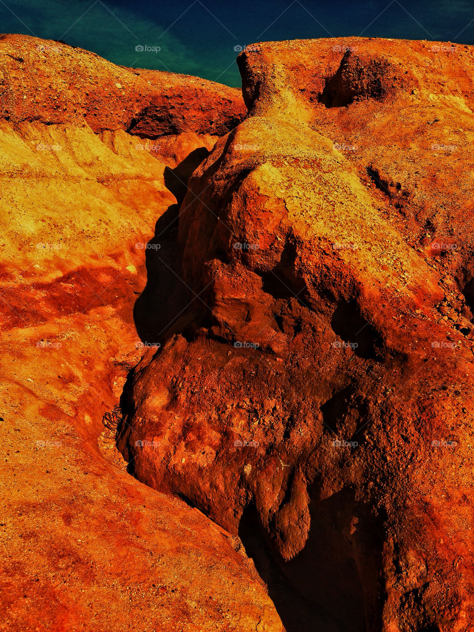 Red sandstone canyon on a beach resembling Martian landscape