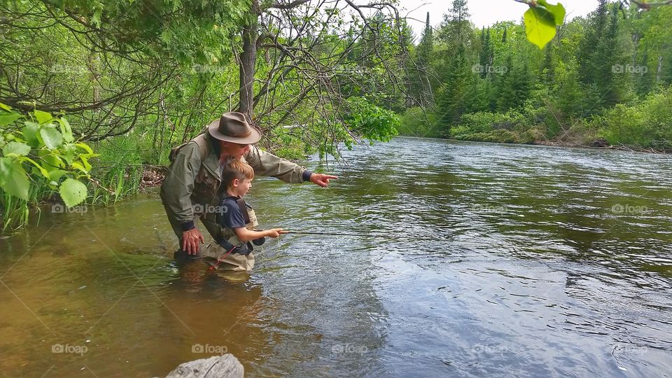fly-fisherman teaches grandson