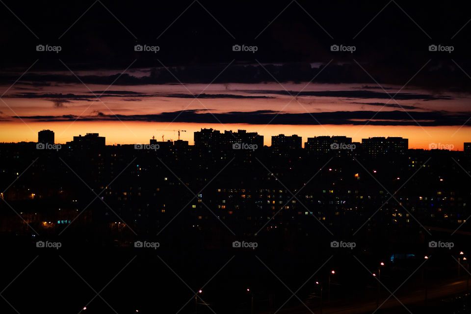 Silhouette of the city on the sunset