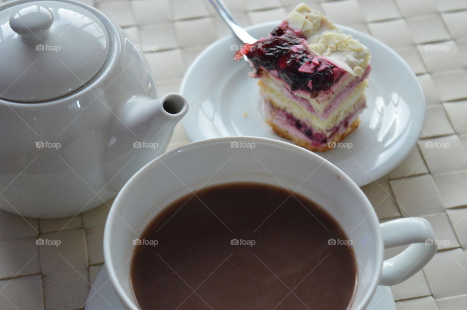 High angle view of slice of cake with coffee cup