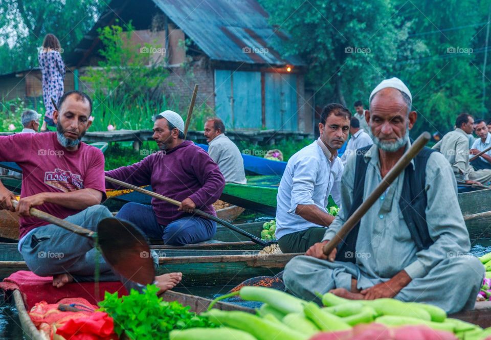 people at the floating vegetable market