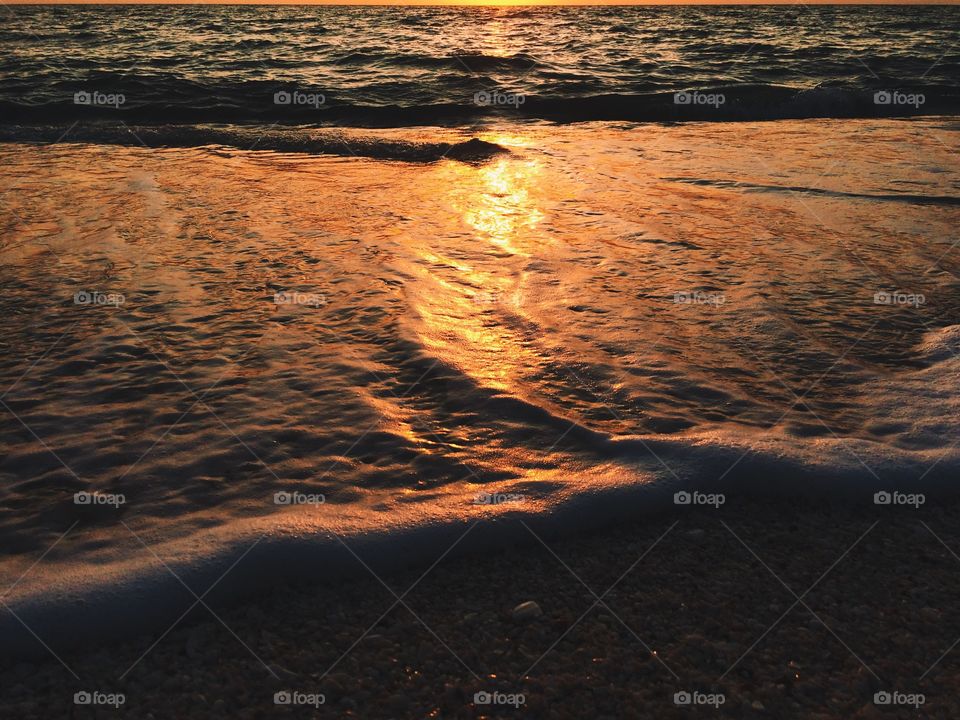 Beach at sunset. Sunset over beautiful beach in Gulf of Mexico