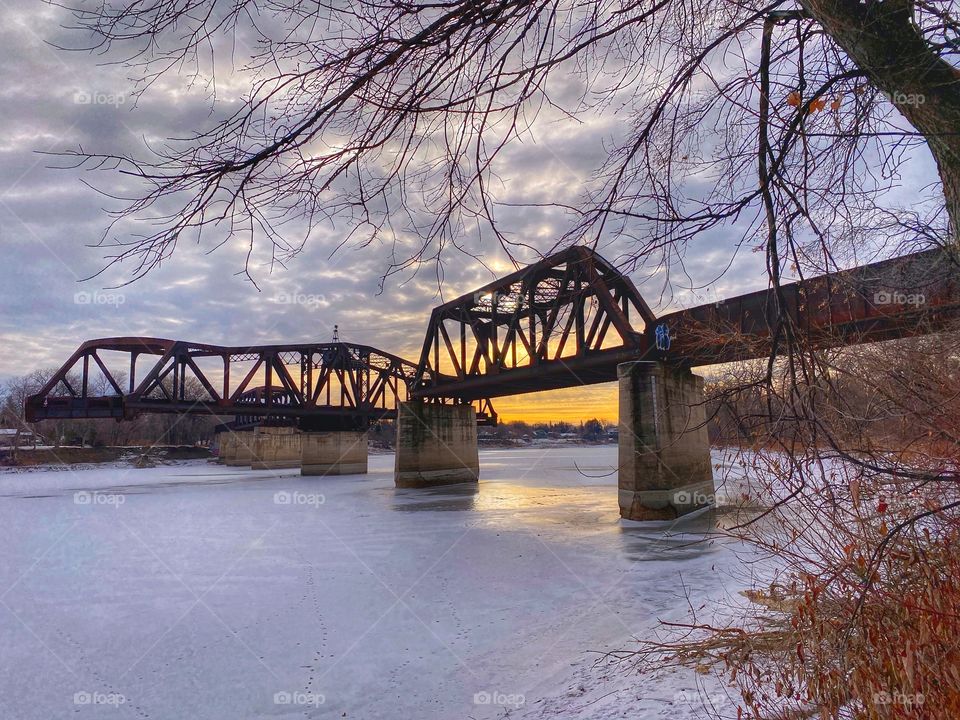 Train bridge over an icy river 