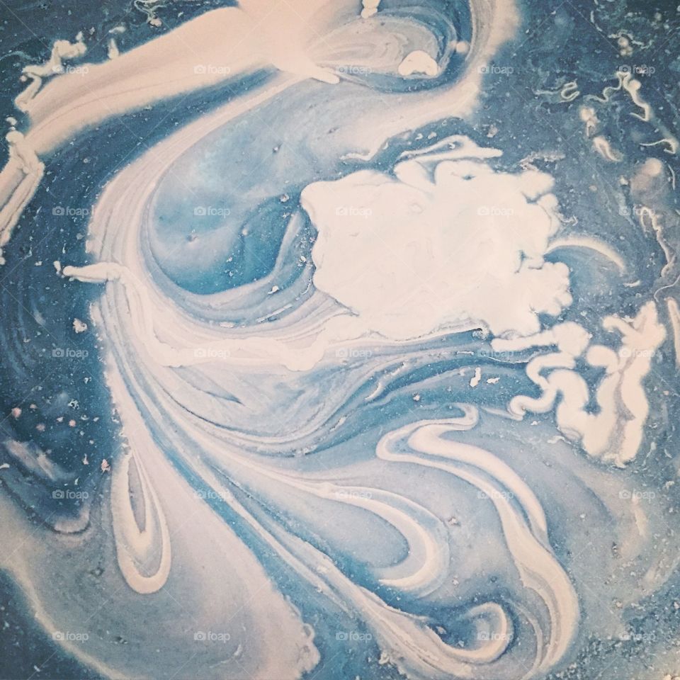 Abstract blue paint swirls