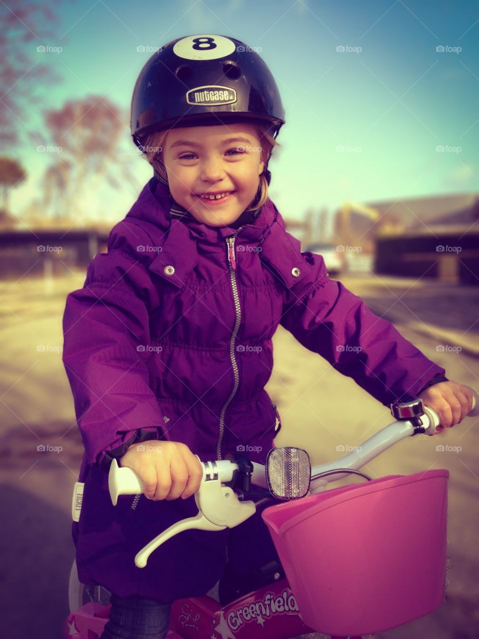 Girl on bicycle. Happy girl riding her first bike