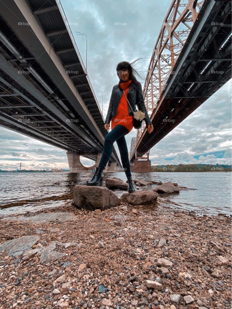 Girl in the black jacket by the river 