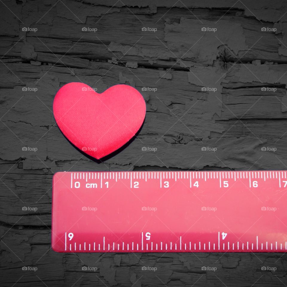 How big is your heart?  A love heart next to a ruler 