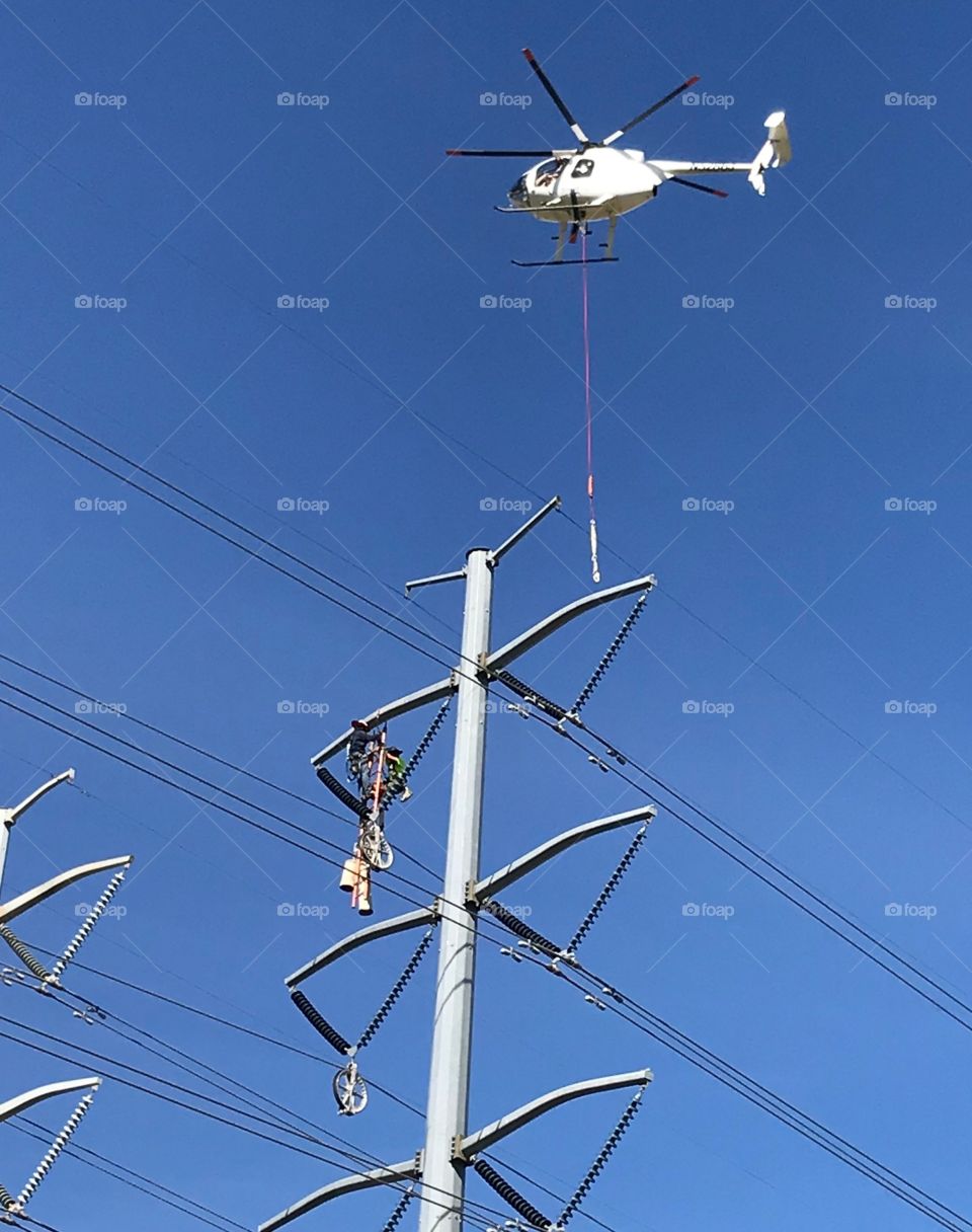 Men at Work in the Power Lines About to Catch a Helicopter Ride