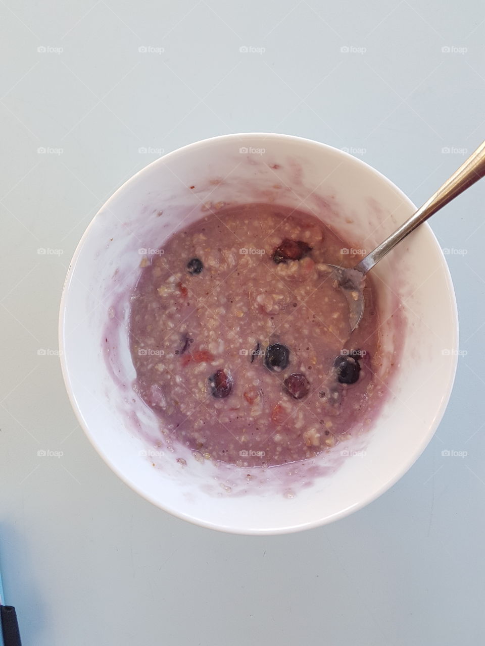 A bowl of mixed berry porridge