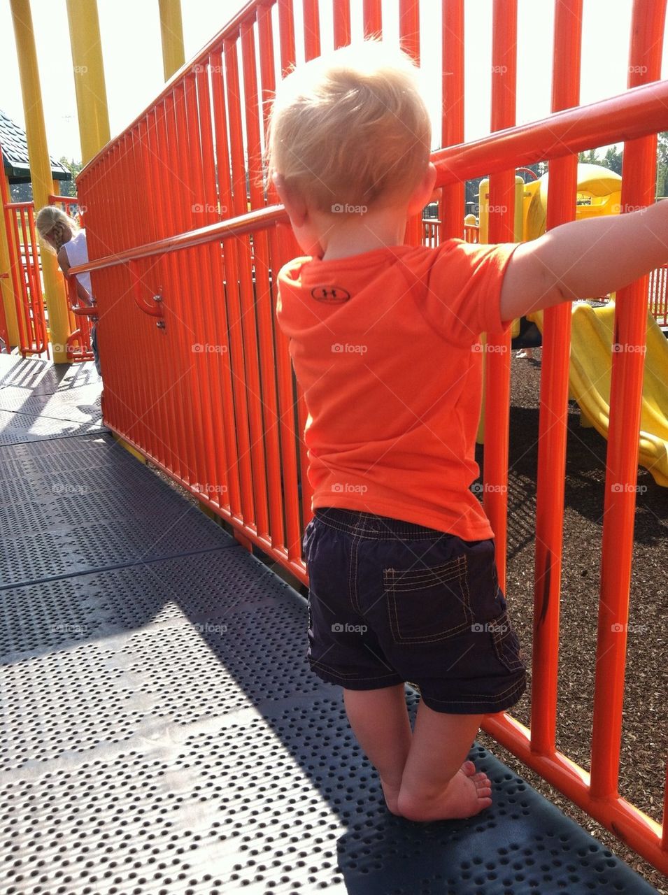 Baby boy trying to Walk to a girl at the park