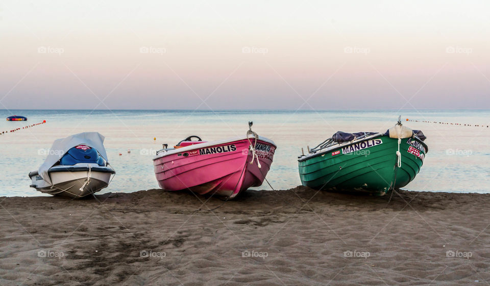 sunrise with three boats