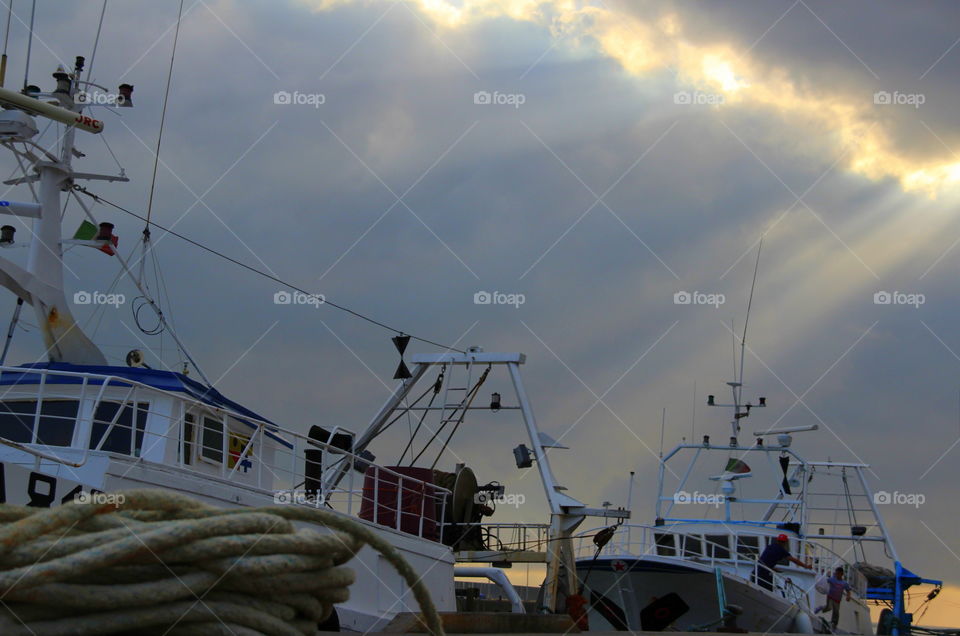 fishing boats at the Pier under sunrays