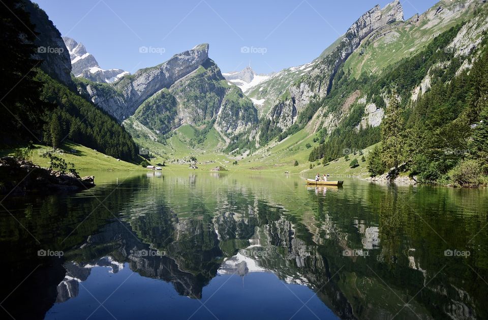 Landscape photo of mountains reflected in lake
