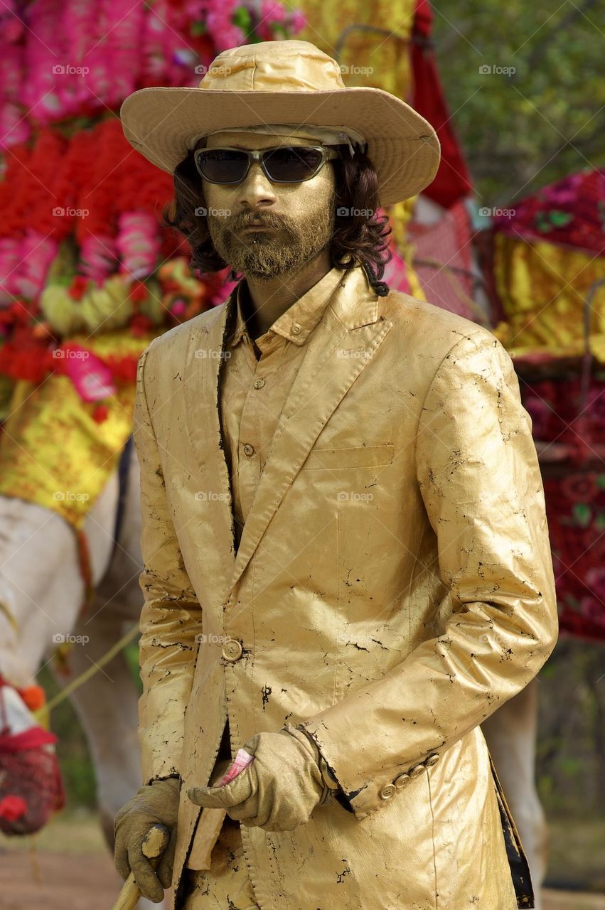 Golden Boy posing statue 