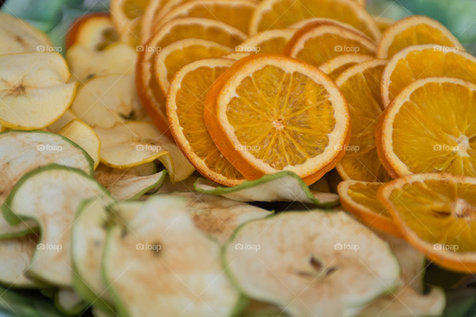 Beautiful fruit laid out of cut oranges and apple slices