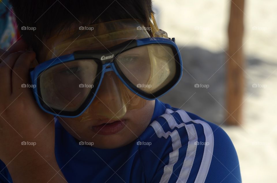 My son getting ready to go to the beach to swim