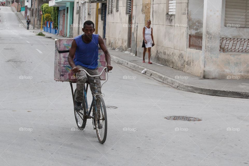 Cuban People.Bicycle bread delivery man in Guantánamo.