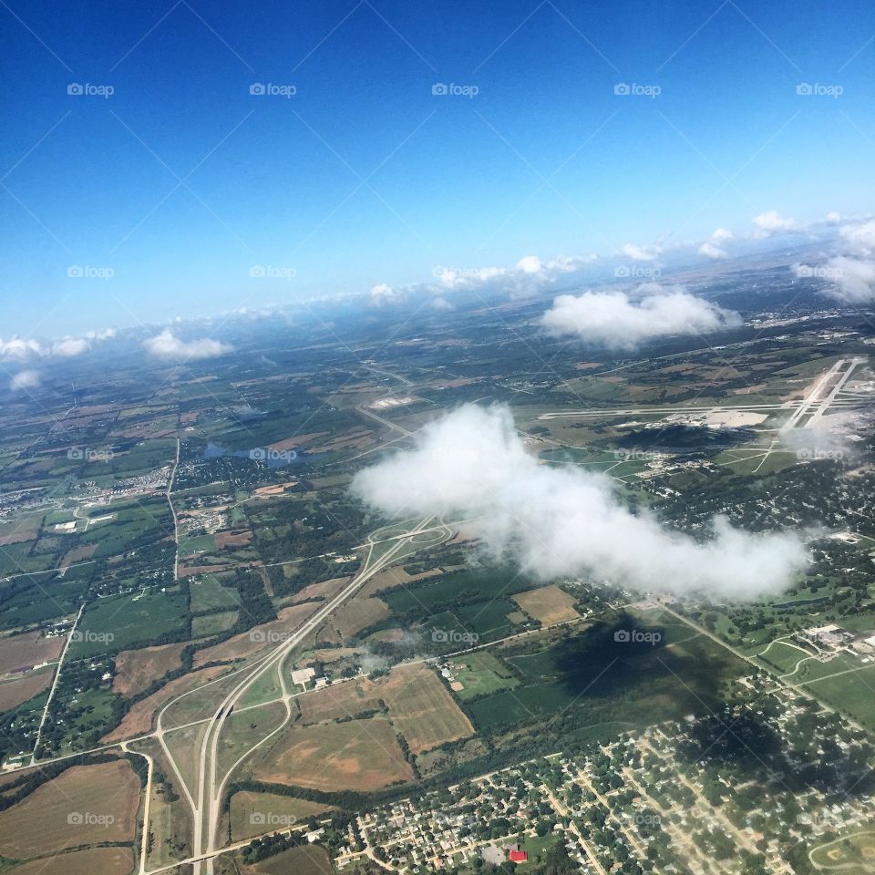 Through the clouds high above Cedar Rapids, Iowa en route to Dallas 