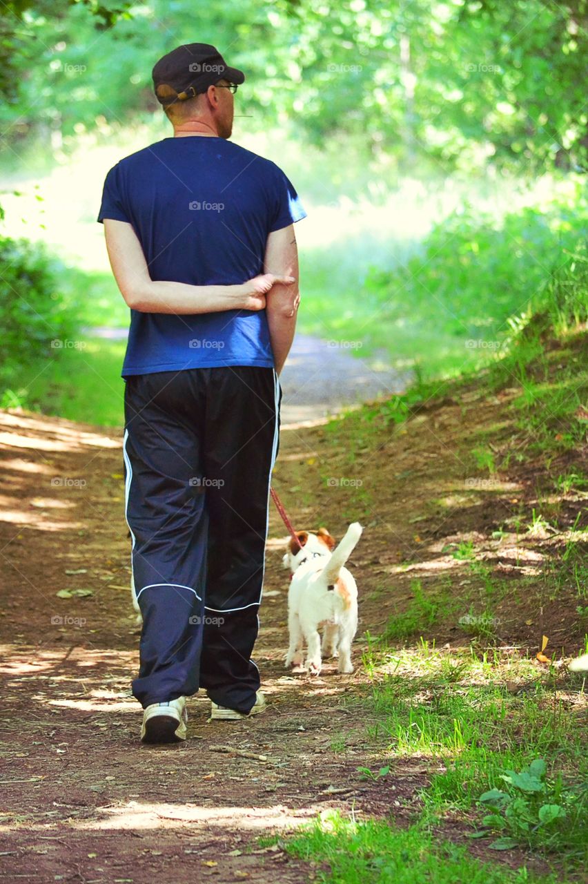 Man walking. A man walking with his dog