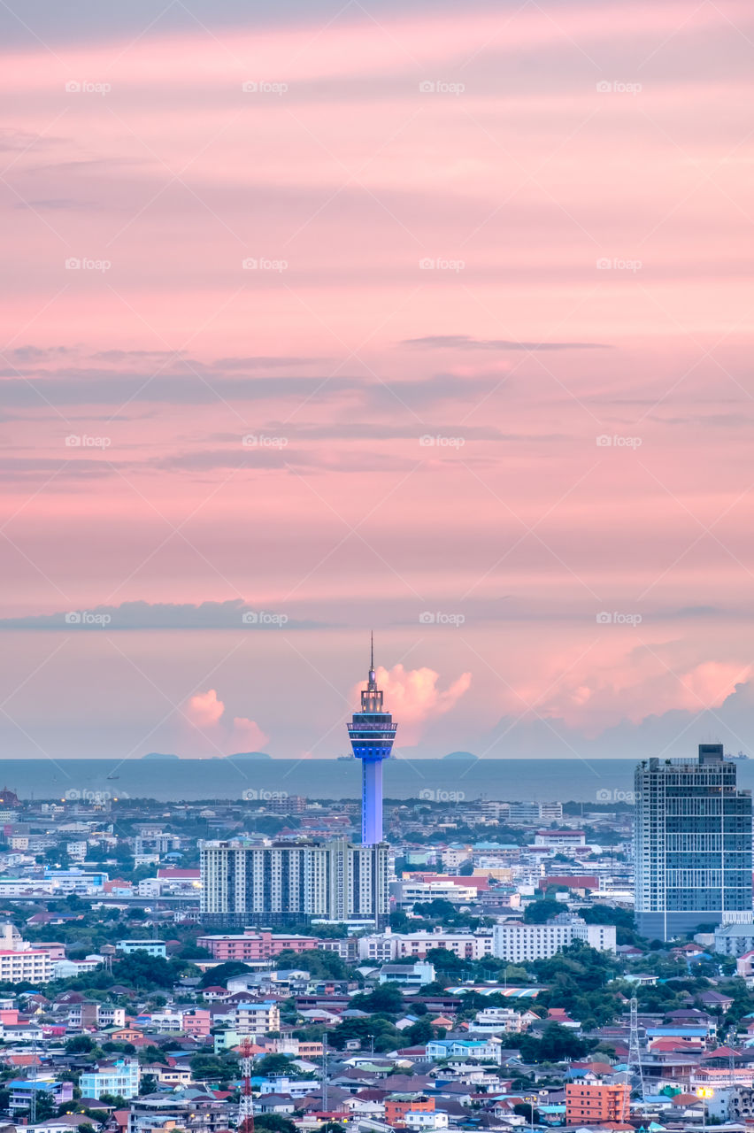 Beautiful landmark tower and city scape of Samut Prakan Province in front of twilight sky