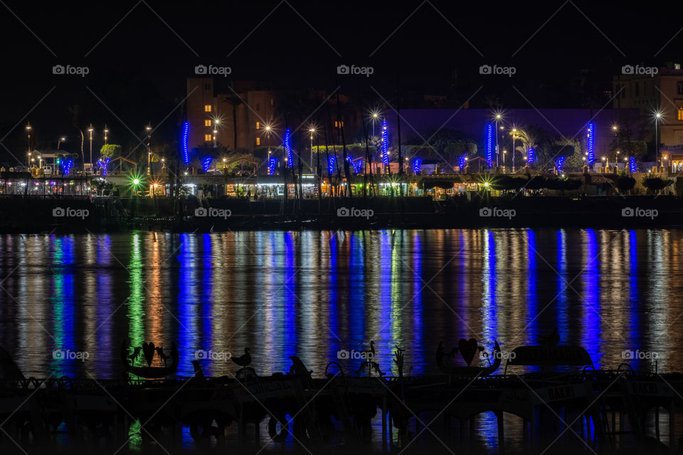 Beautiful reflection of night light on surface  of Nile river