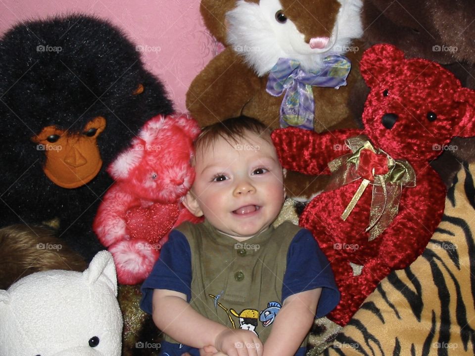 Baby with stuffed animals