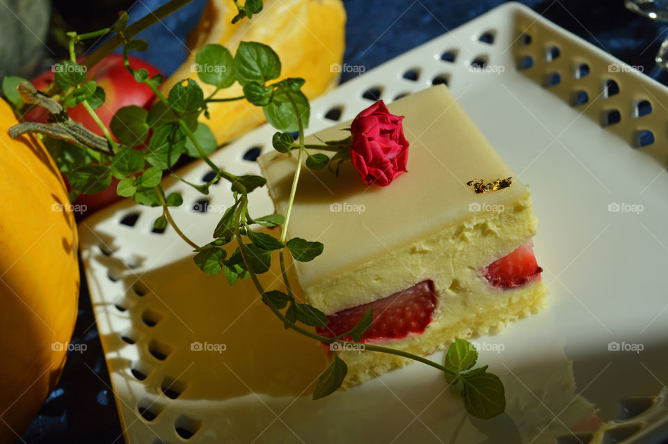 Fraisier classic french strawberry shortcake with crème pâtissière and marzipan with tea rose and fresh mint spring garnish 