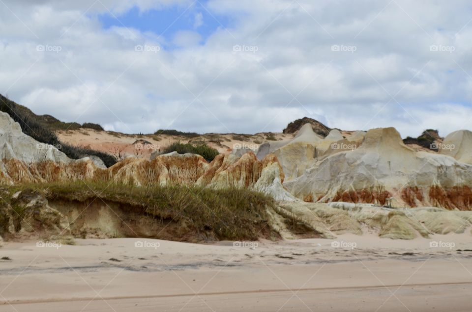 Sand rocks coloured on beach. Canoa quebrada Ceara brazil 